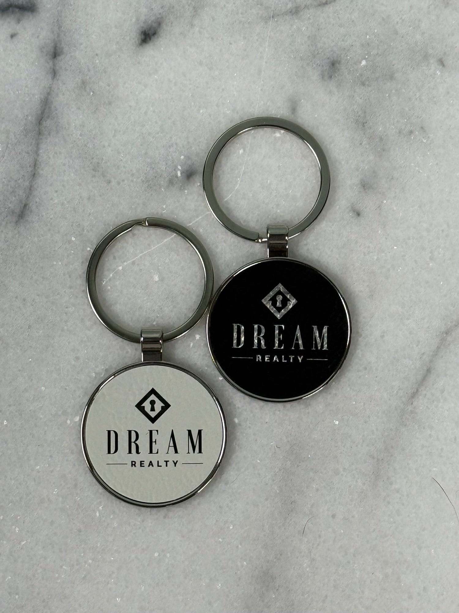 Custom engraved round keychain with personalized business logo and laser engraved design