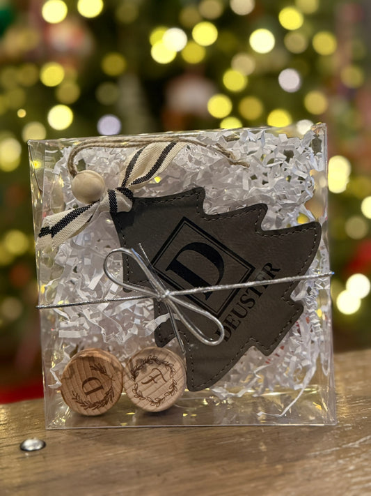 Custom monogram holiday ornament paired with engraved wooden bottle stoppers
