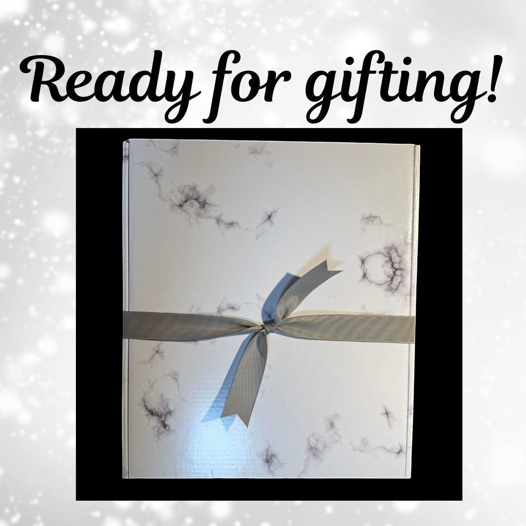 The Creative Nook personalized marble frame gift box wrapped with a grey ribbon, ready for a wedding or anniversary.