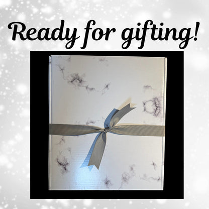 The Creative Nook personalized marble frame gift box wrapped with a grey ribbon, ready for a wedding or anniversary.