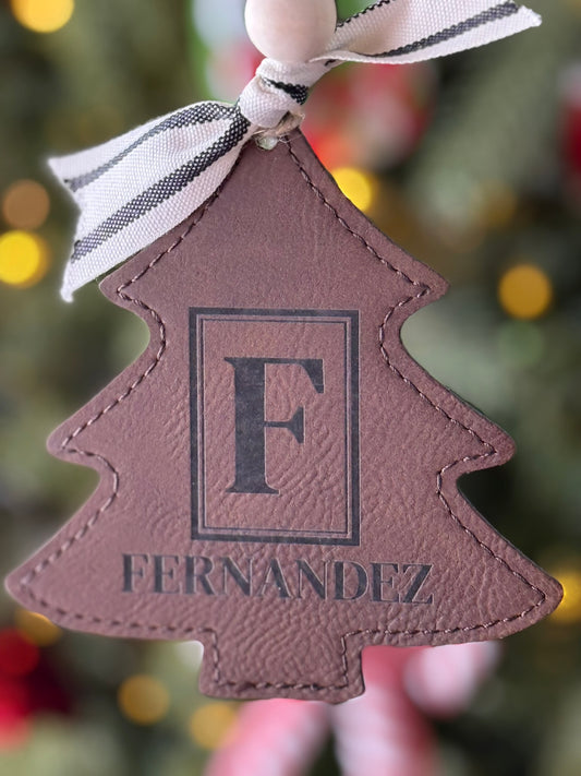 Monogram holiday ornament with elegant engraved lettering on leatherette