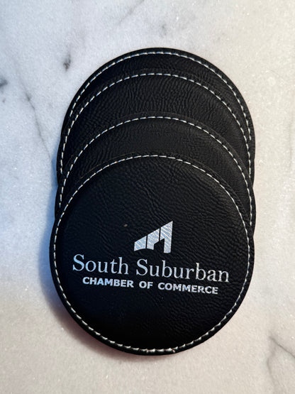 Personalized leatherette coasters included in a client appreciation gift set
