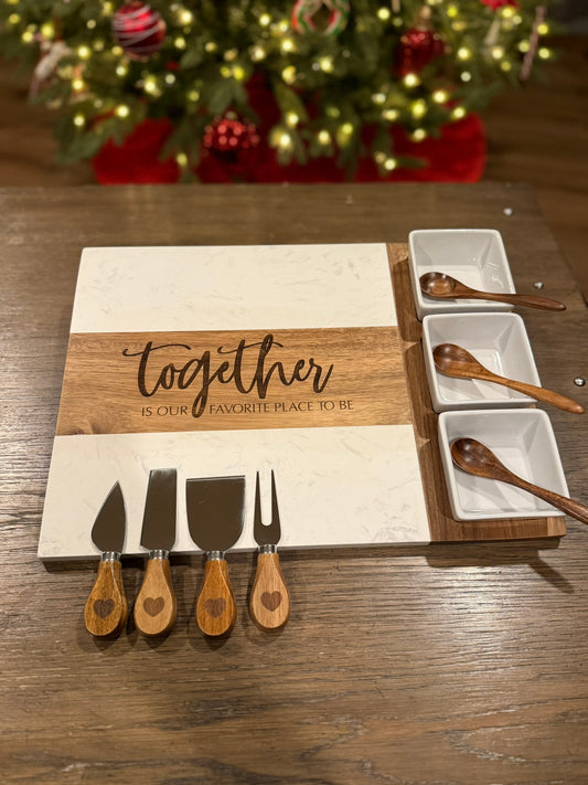 Eleven piece personalized charcuterie board set showing all included bowls utensils and cheese knives