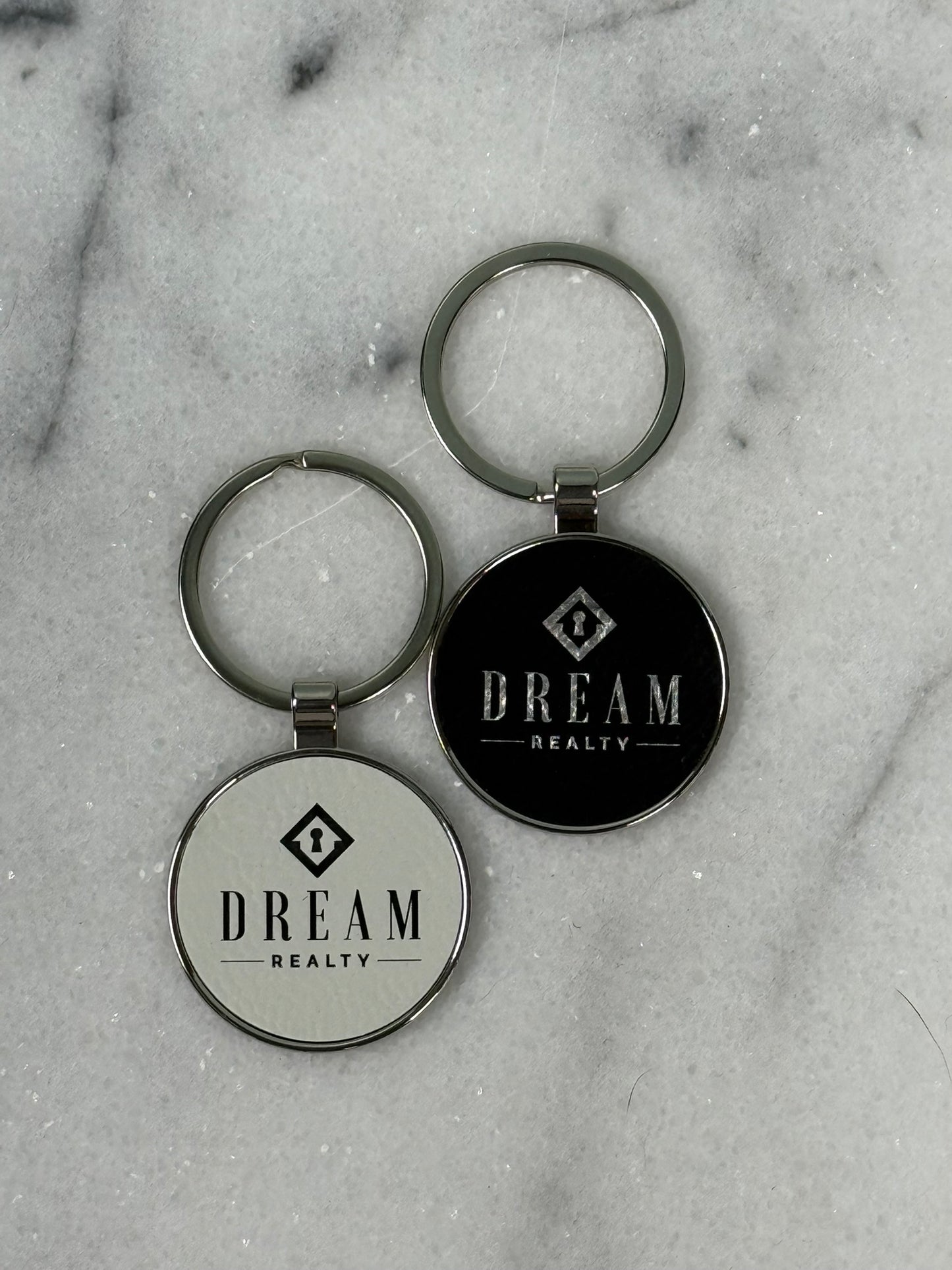Custom engraved round keychain with personalized business logo and laser engraved design