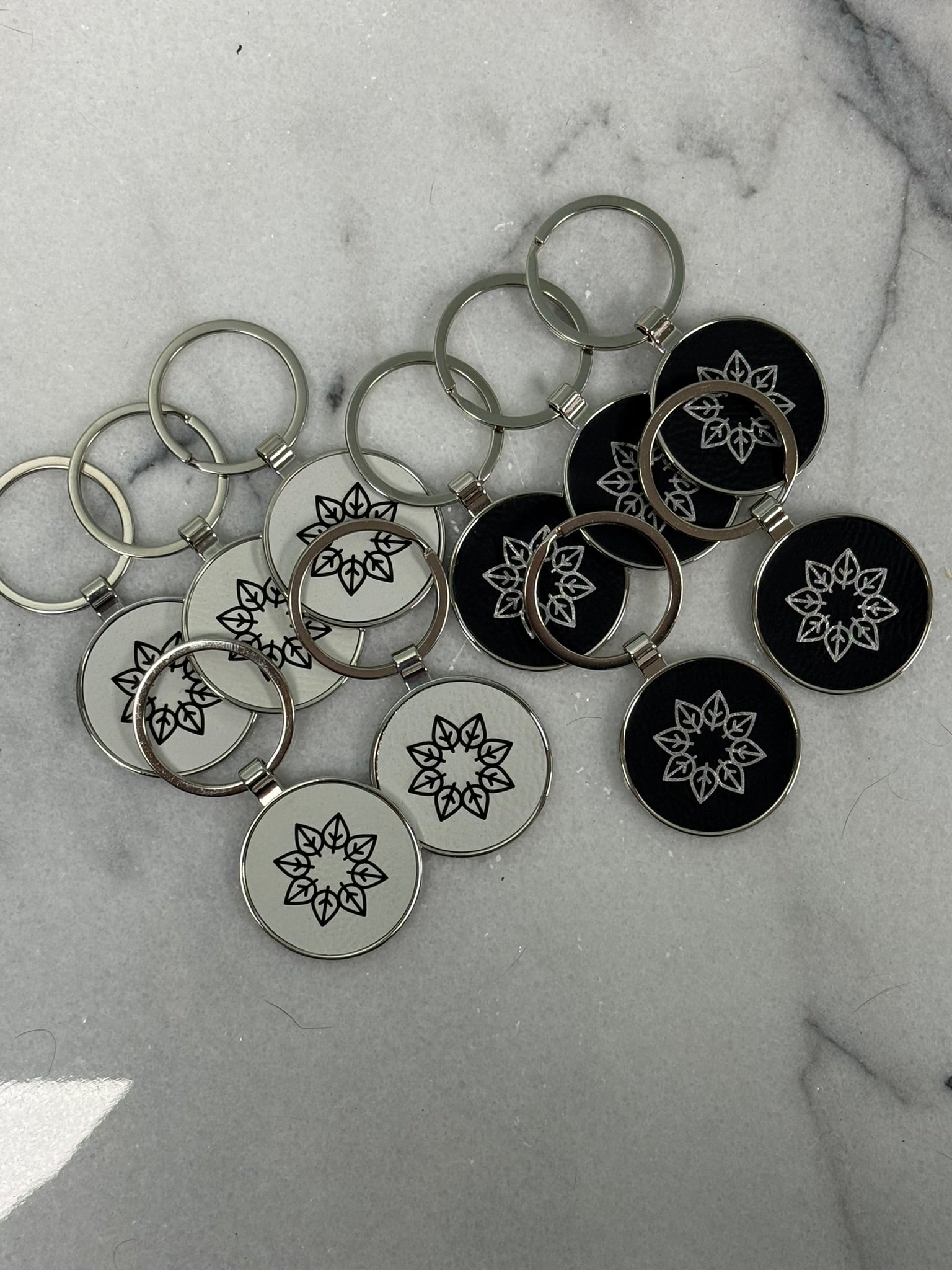 Set of custom engraved round keychains for promotional products, corporate gifts, and events