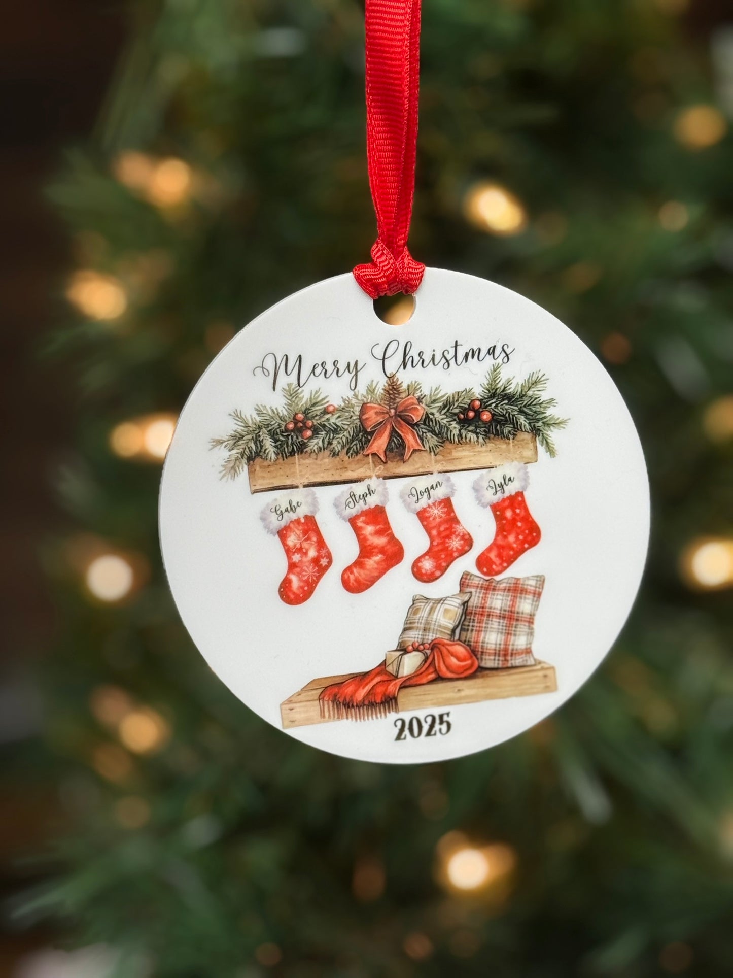 Personalized family Christmas stocking ornament on Christmas tree, white acrylic round with printed mantel scene and custom names.