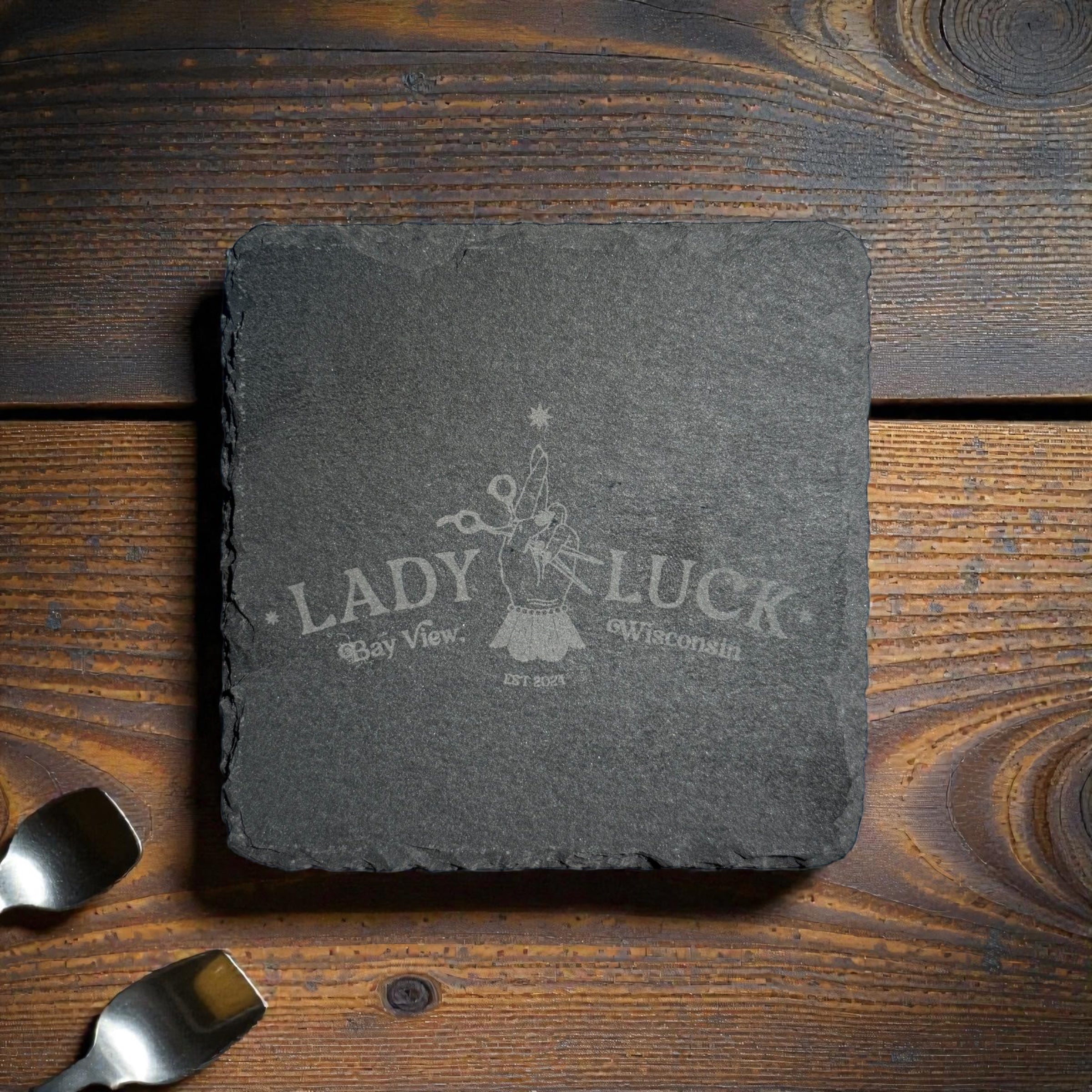 Custom laser engraved slate coaster featuring a local Milwaukee business logo