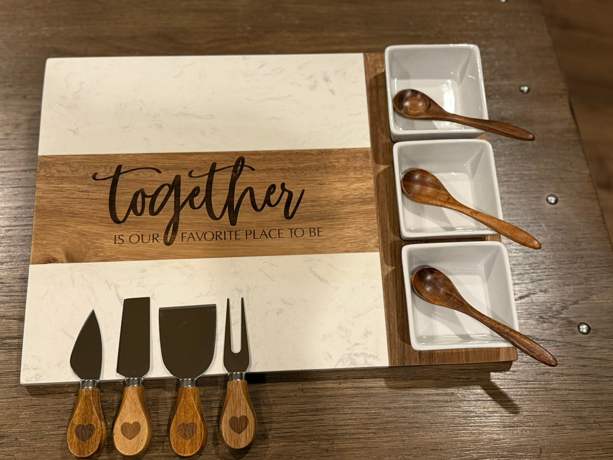 Personalized marble and acacia wood charcuterie board with custom laser engraving and complete 11-piece serving set in elegant gift box