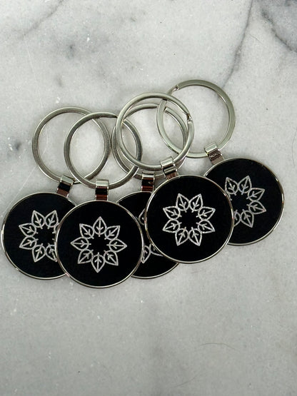 Personalized round engraved keychain attached to keys for business branding or gifts