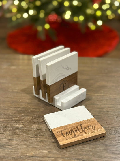 The Creative Nook personalized marble and acacia wood coaster set with custom engraving and matching display base.
