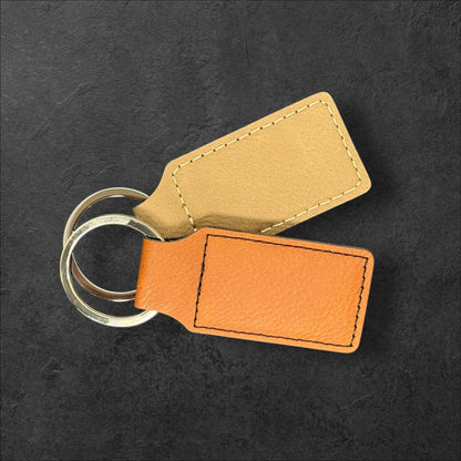 Personalized leatherette keychain displayed in lifestyle setting as a custom gift idea