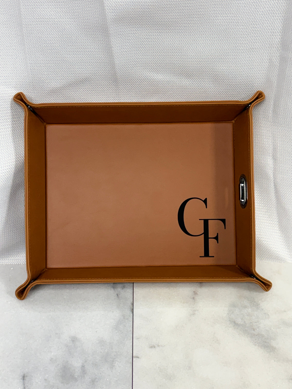 eatherette valet tray engraved with a personalized design, showing spacious storage for keys, wallet, phone, and accessories